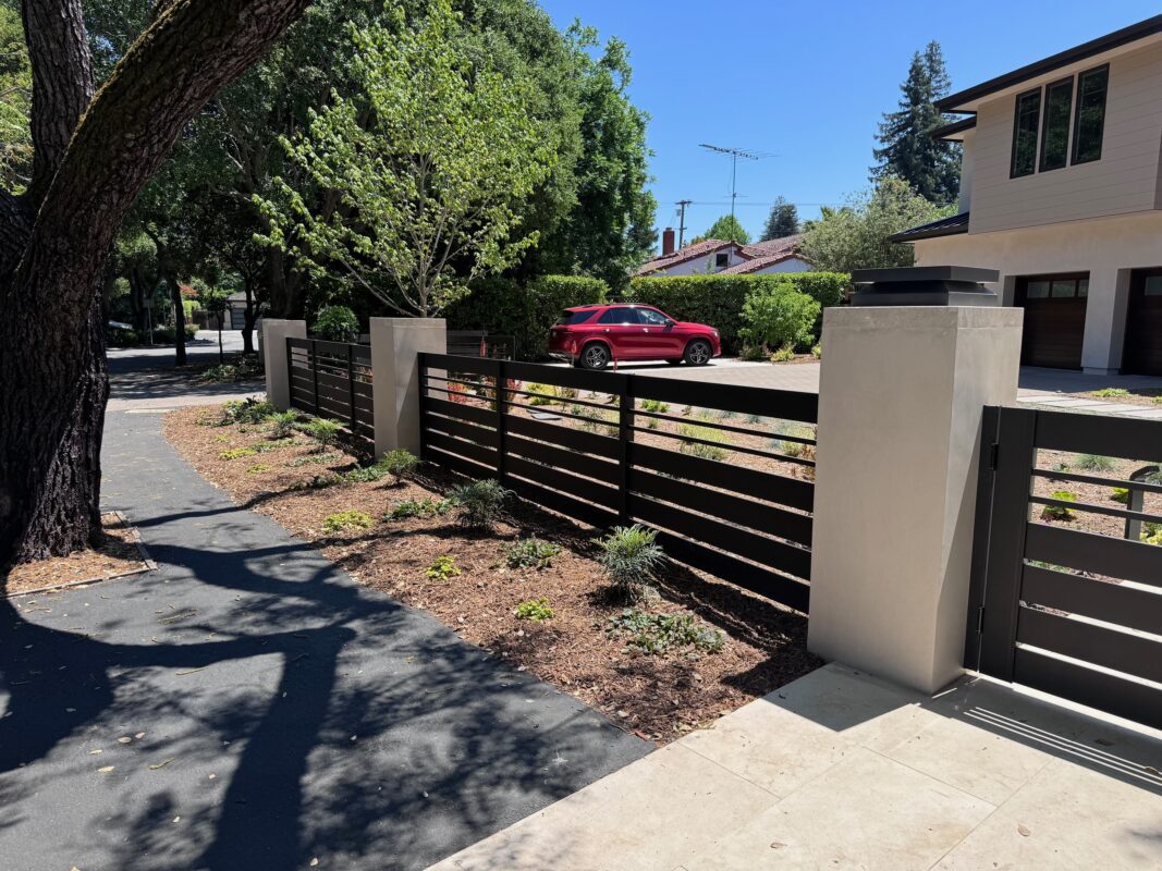 Modern bronze aluminum fence and gate enhance property aesthetics in Menlo Park.