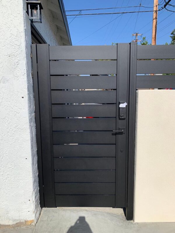 Modern black aluminum fence gate showcasing sleek design in Yorba Linda, CA.