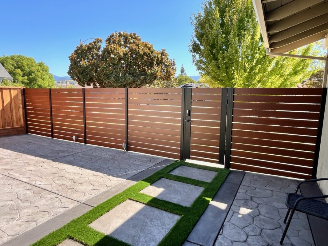 Modern aluminum fence and gate installation in San Jose, CA with wood look design.
