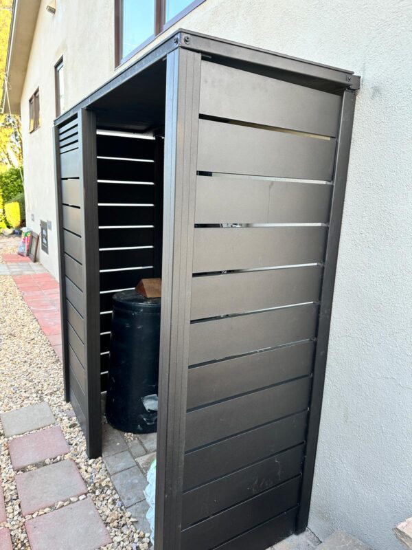Modern bronze aluminum fence installation in Ventura, enhancing privacy and aesthetics.