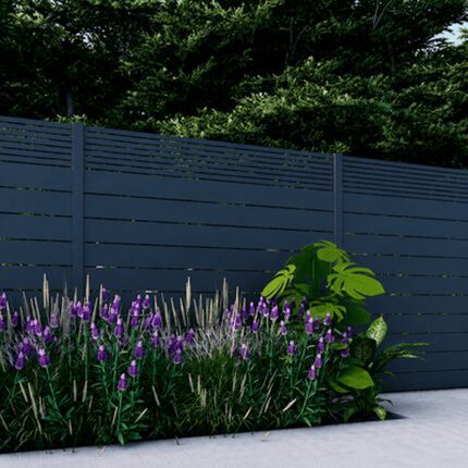 Dark gray Dallas Style Alumission aluminum fence installed in a landscaped yard