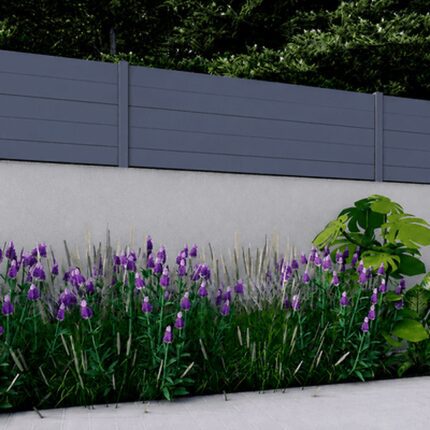 Dark gray New York Style Alumission aluminum wall topper installed above a garden wall