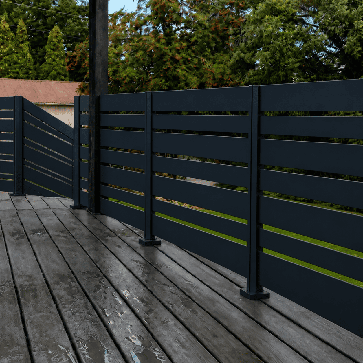 Black Miami aluminum railing with six 5.5-inch slats, five one-inch accent slats and half-inch gaps