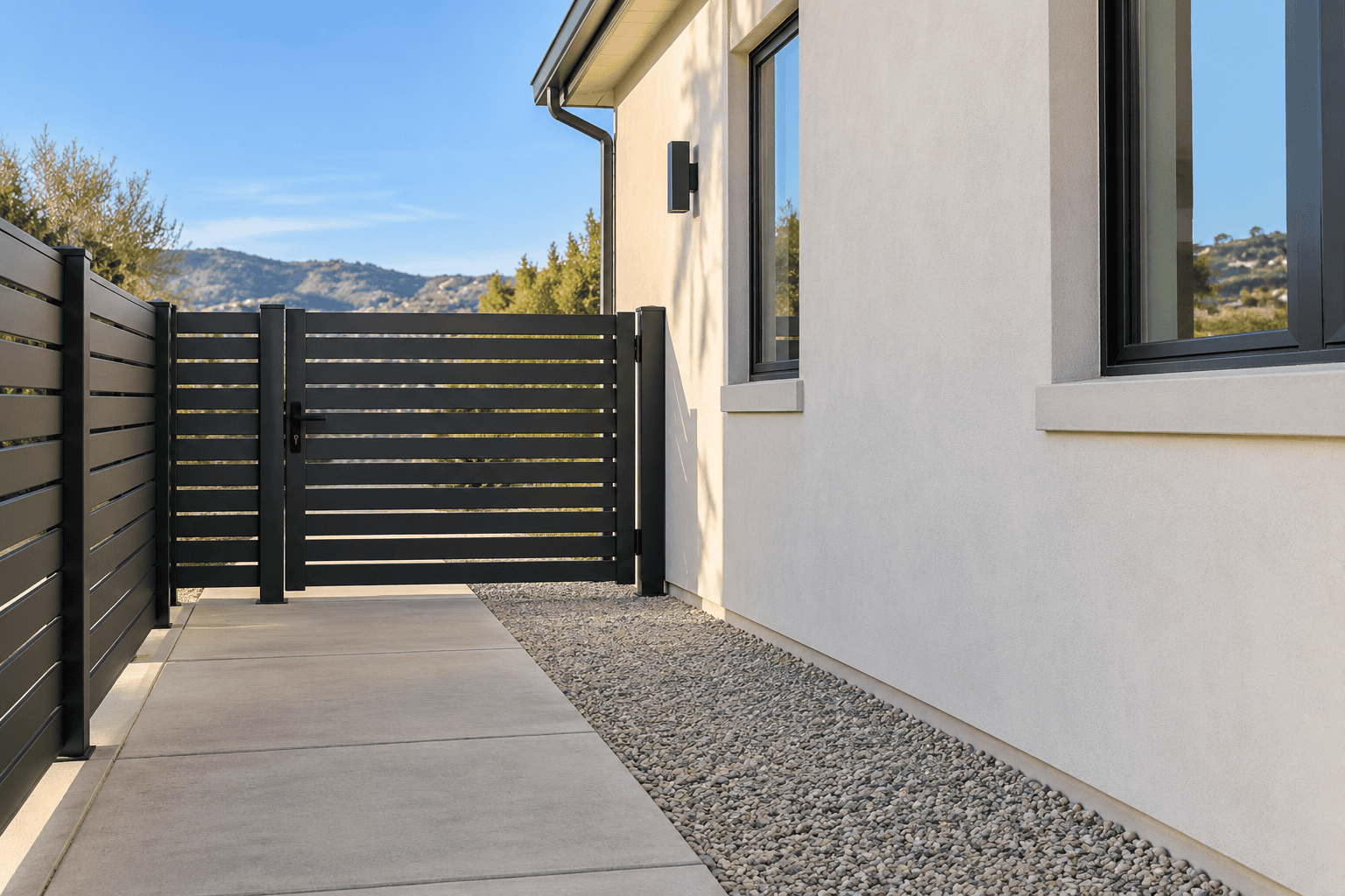 AI-generated concept of an aluminum side gate with concrete paving and gravel beside a stucco home