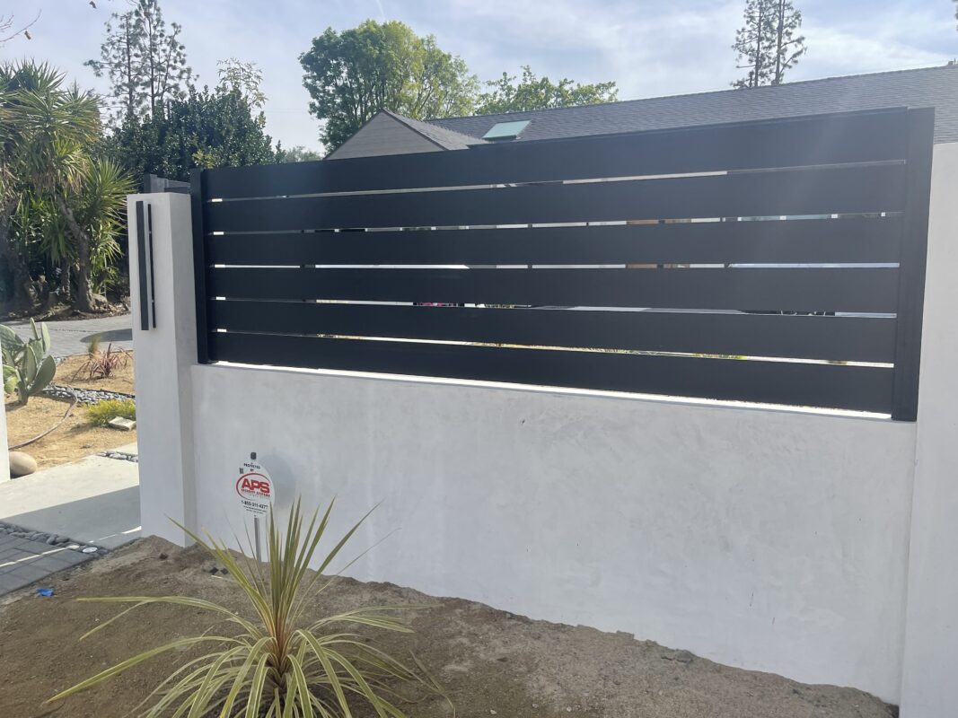Black Wall Topper in Los Angeles Style Next To Walkway
