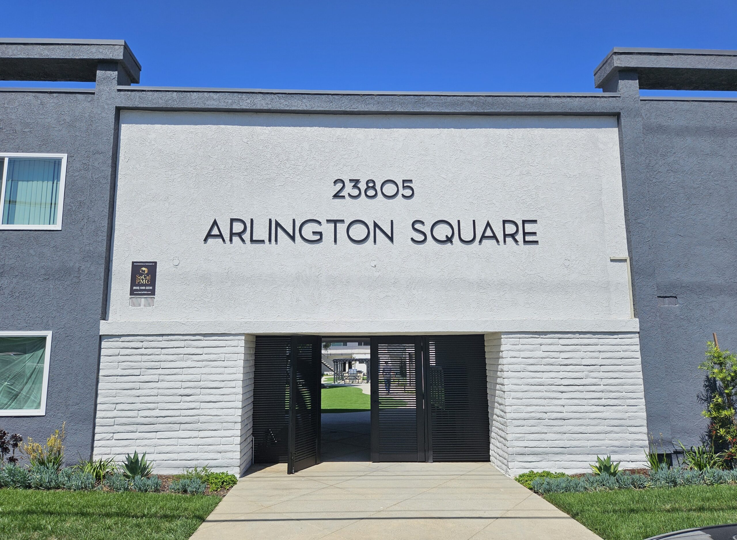 Black aluminum gate installation at Arlington Square entrance in Torrance, CA.