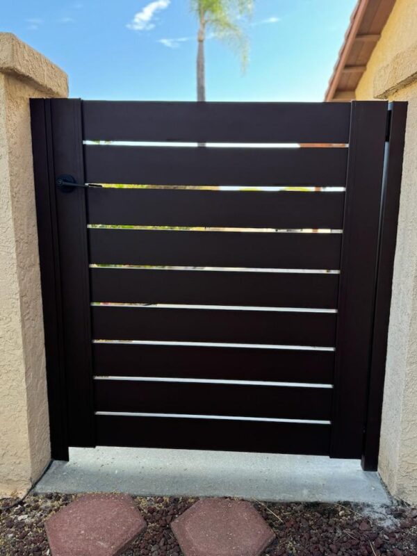 Sleek bronze gate design with horizontal slats, enhancing security and elegance.