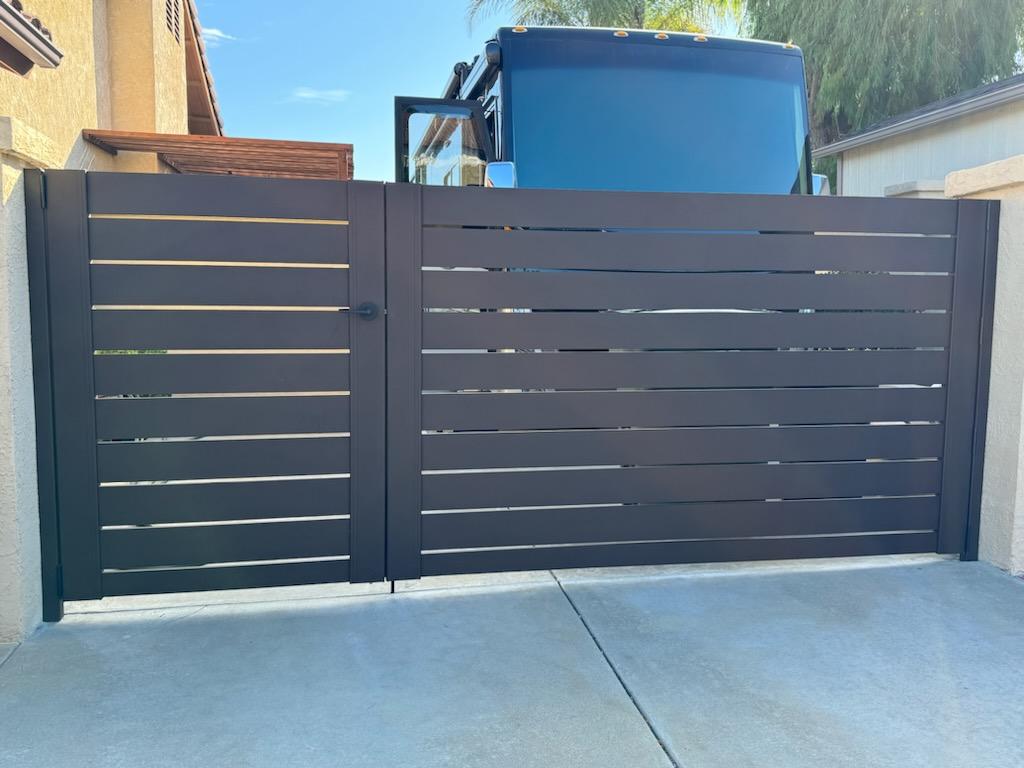 Sleek bronze gates installed, enhancing curb appeal and security in San Diego.