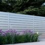 White Los Angeles Style Alumission aluminum fence kit installed in a landscaped yard