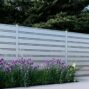 White Miami Style Alumission aluminum fence kit installed in a landscaped yard