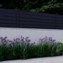 Black Los Angeles Style Alumission aluminum wall topper kit installed above a garden wall